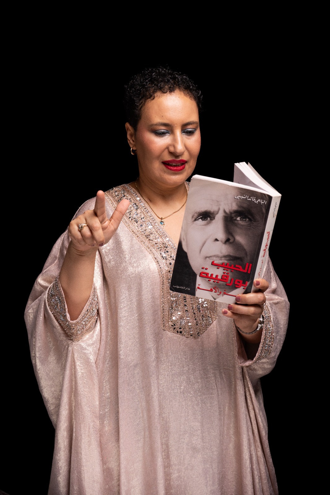 Maha Jouini holding book